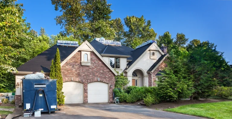 should i stay home during roof replacement-home with construction materials in the yard and driveway