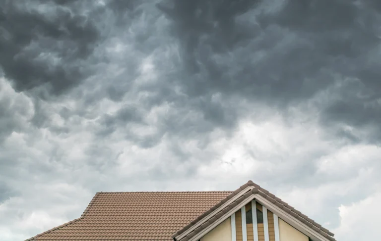 impact resistant shingles-storm looming over a home