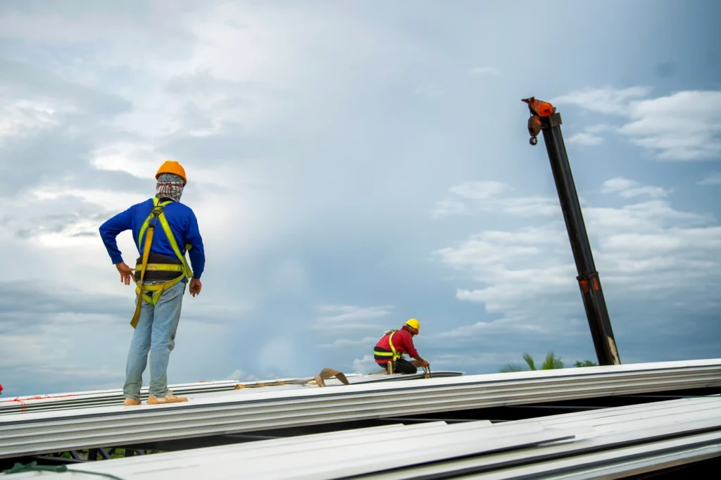 Roof view of commercial contractors replacing roofing system in bloomington in