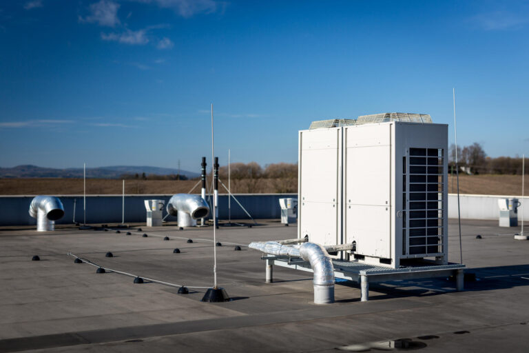 commercial roof vents-large commercial flat roof with various parts