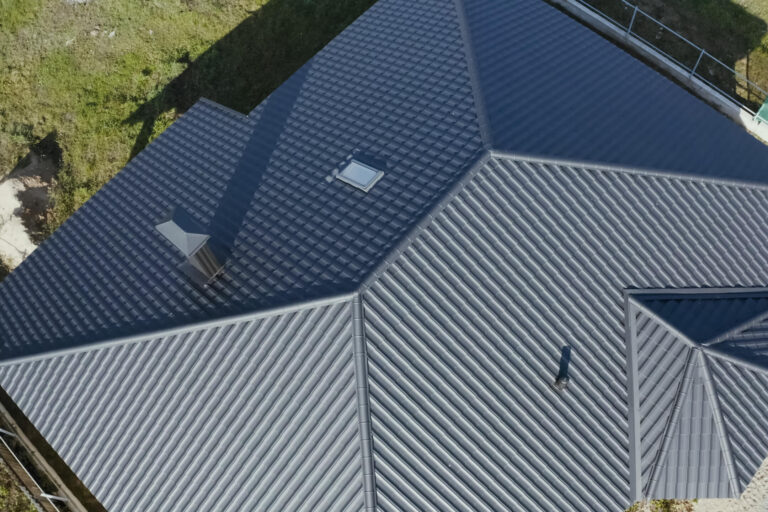 corrugated metal roofing-arial view of home with corrugated metal roof