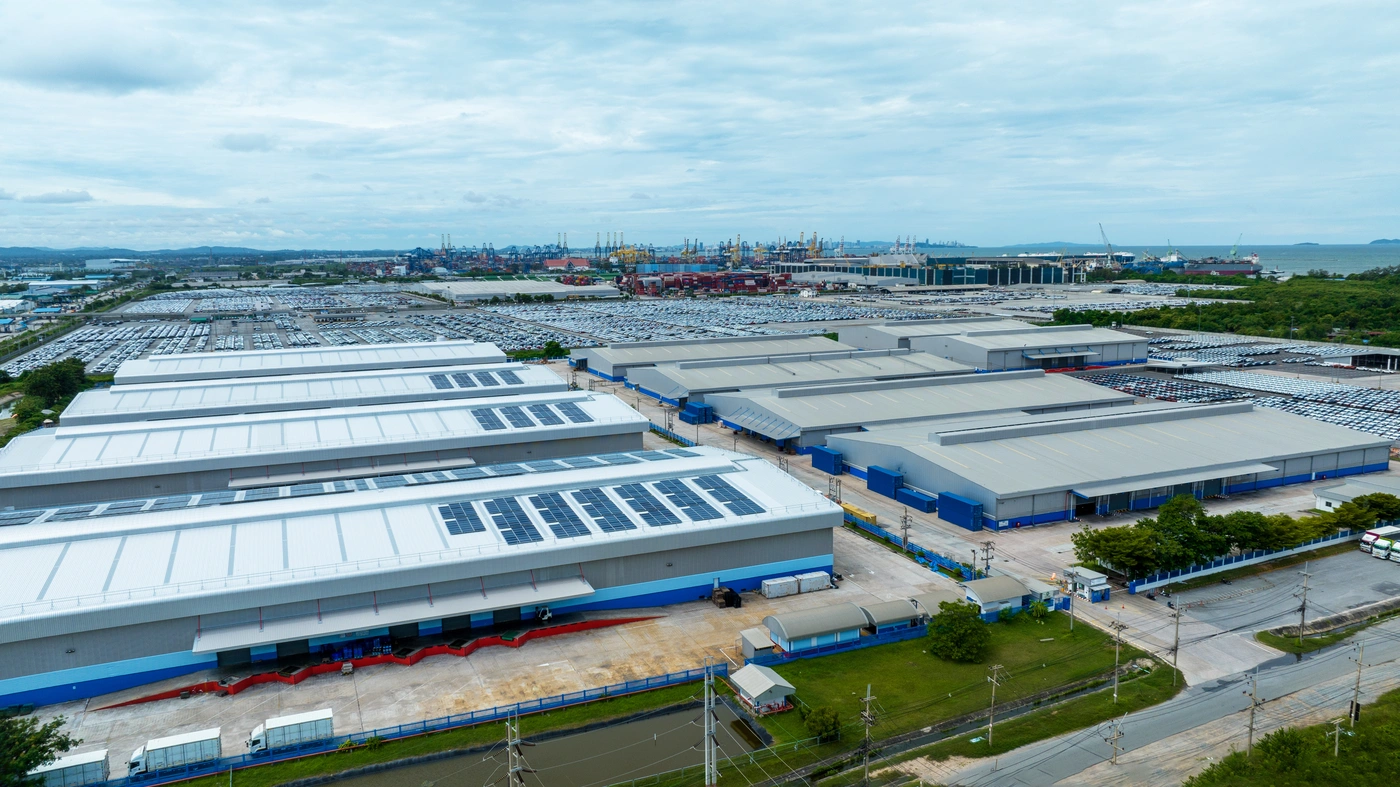 aerial view of large commercial buildings with flat and metal roofing systems