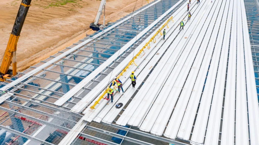 roofing contractors install roof on new construction project