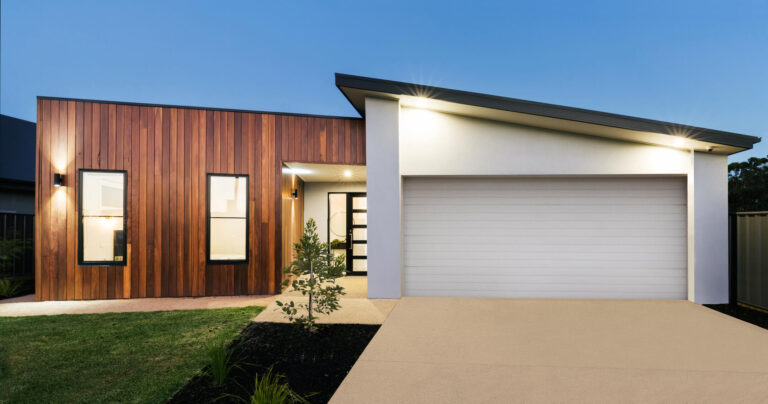 flat roof home insurance-modern home with wooden vertical siding and flat roof