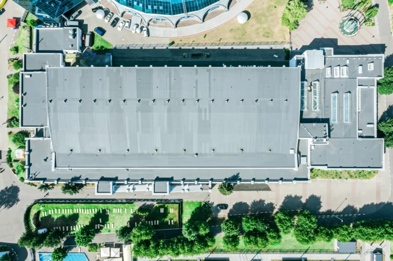 flat roof top view business. commercial roof leak repair