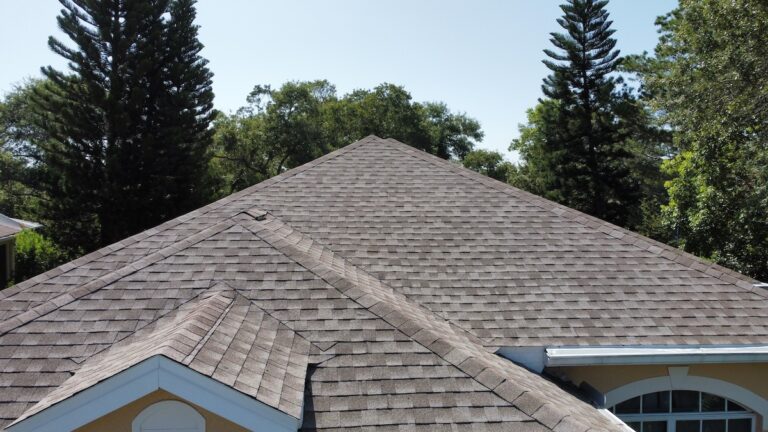 Drone photo of brown asphalt shingles on house
