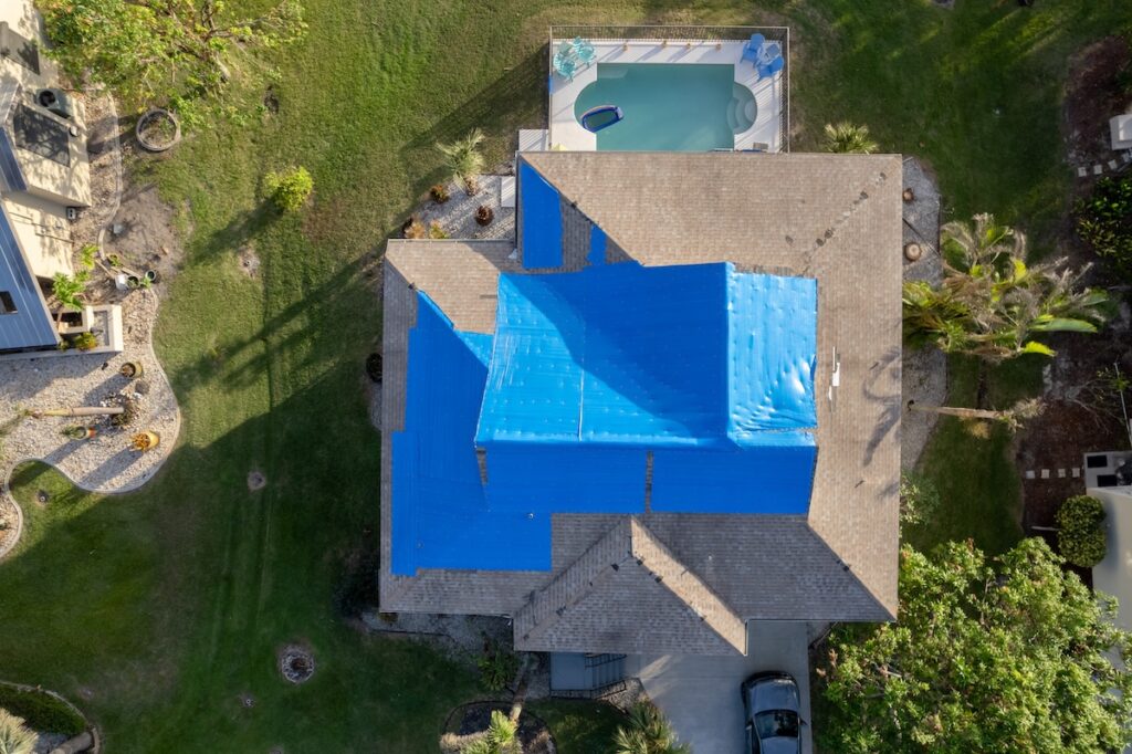 Tarp on house