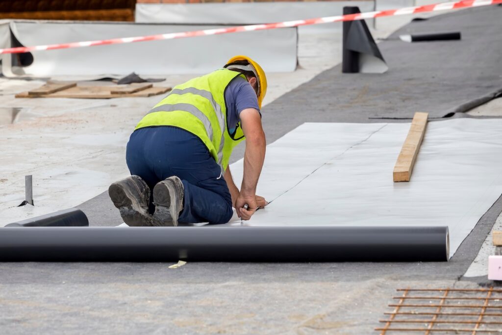 Waterproofing and insulation at construction site, waterproofing membrane preventing water penetration. Exterior vapor barrier
