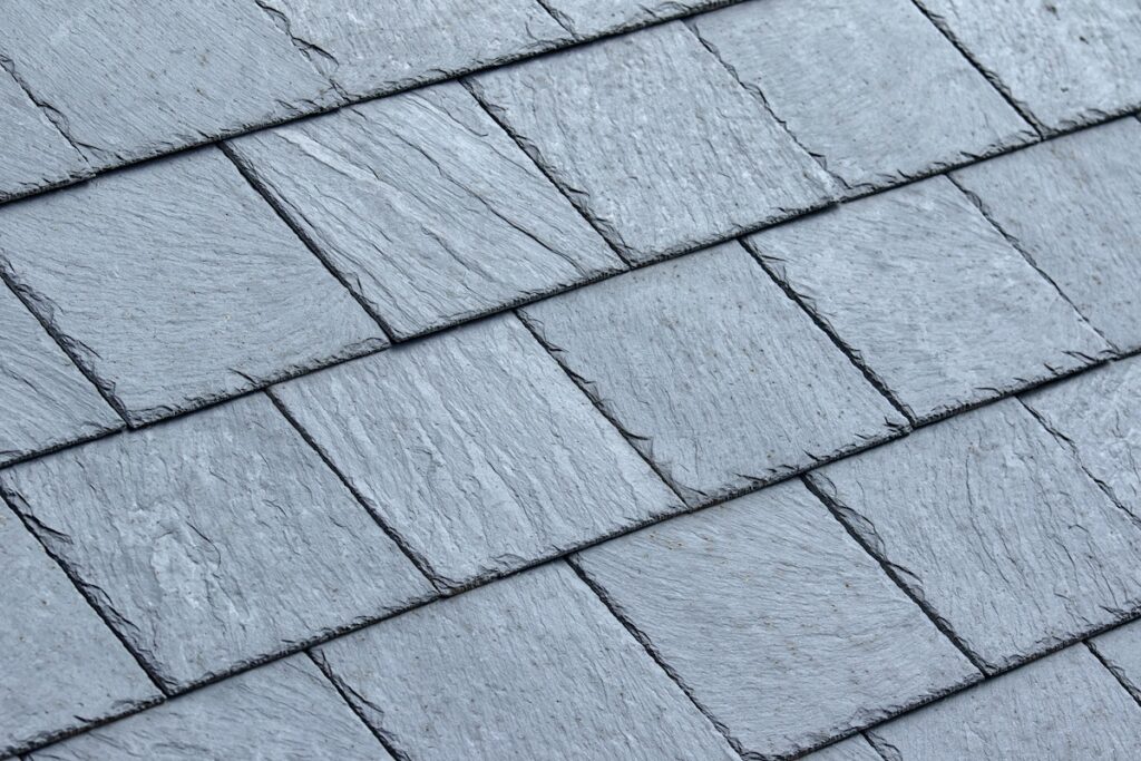 Closeup of clean grey slate roof tiles 