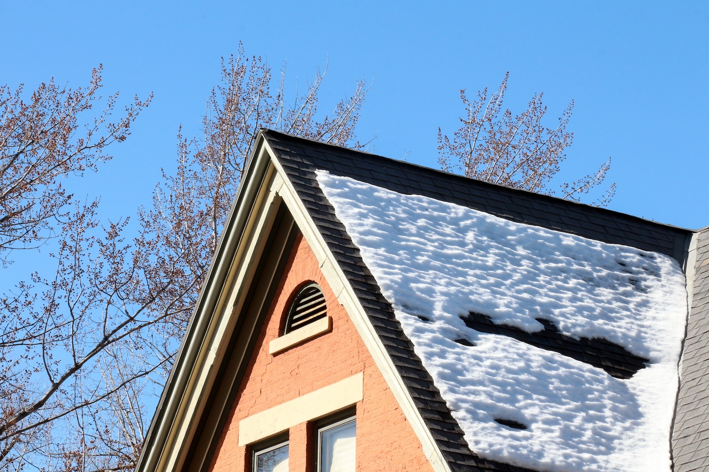 snow on residential home roof
