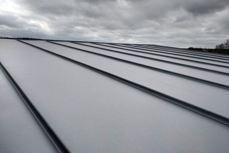 Close-up detail of house roof made from gray metal sheets
