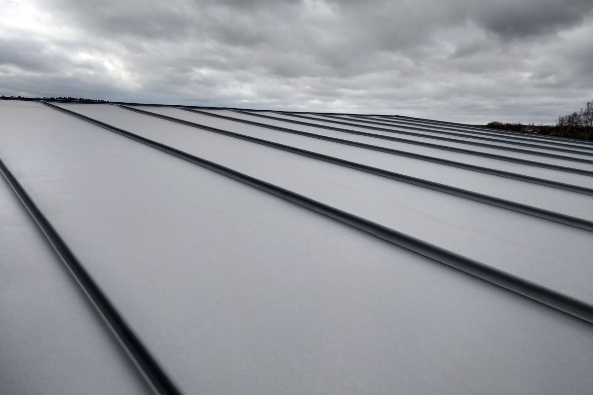 Close-up detail of house roof made from gray metal sheets