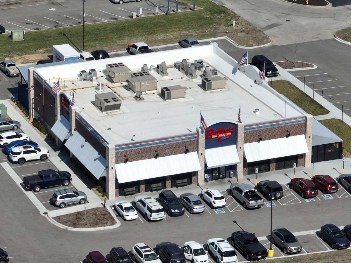 Aerial view of a white commercial flat roof