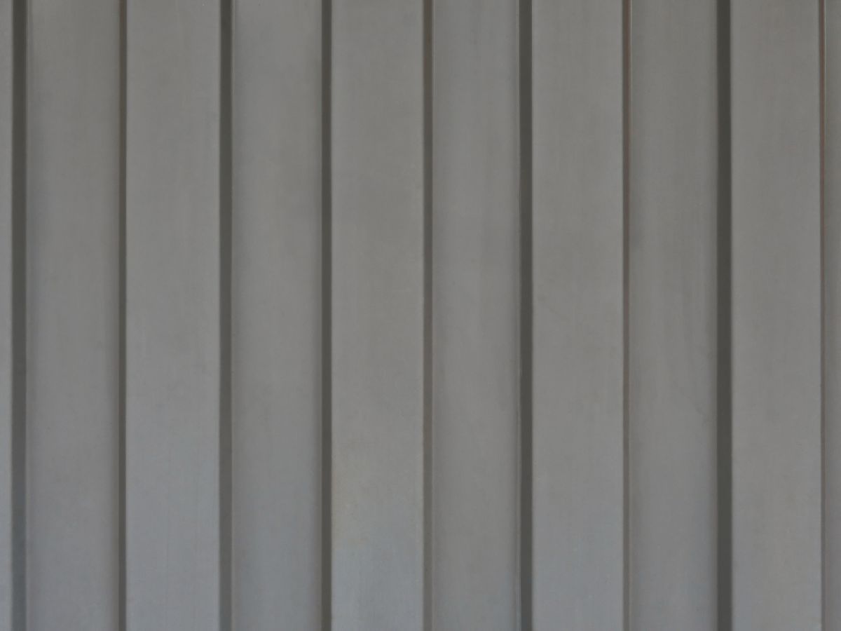 Gray Sheet Metal with Trapezoidal Structure Running in a Row